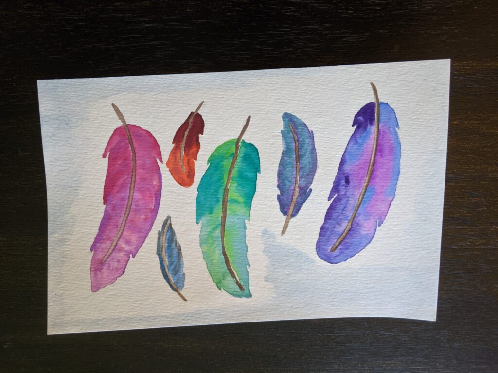 A watercolor painting of six multicolor feathers in shades or reds, blues, greens, and purples. 