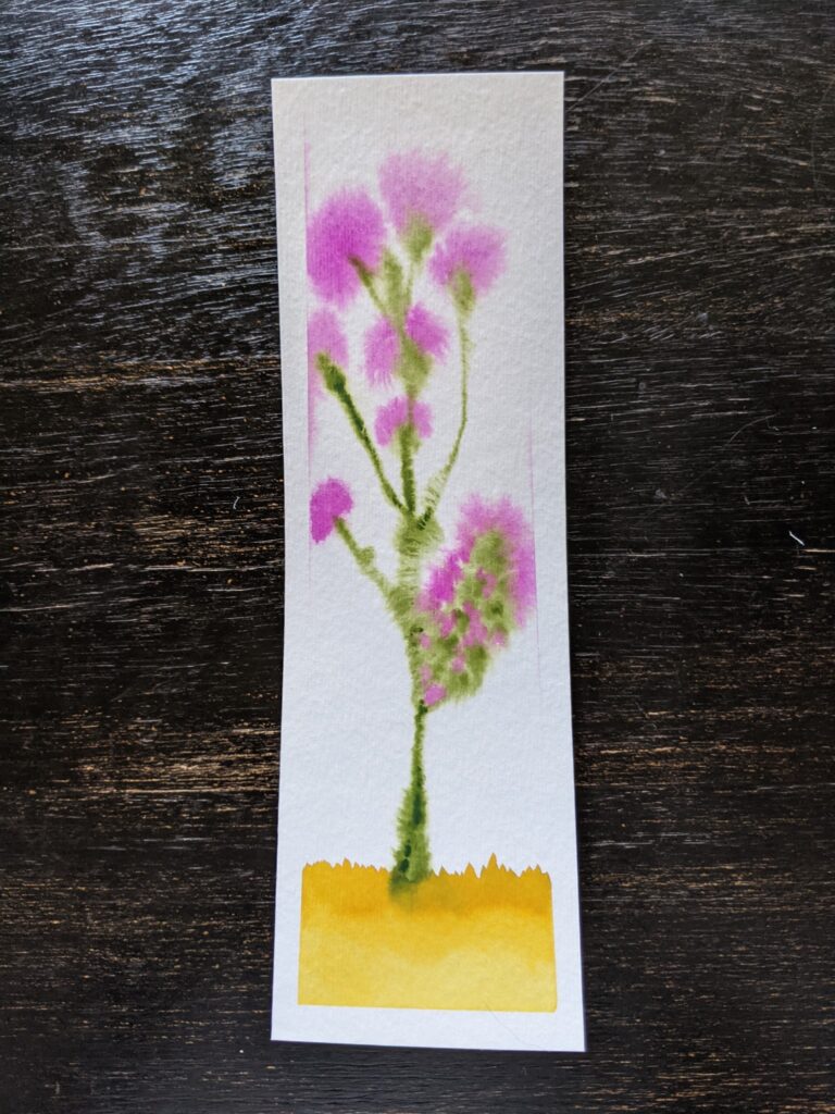 A bookmark with a watercolor painting of a purple thistle plant. 